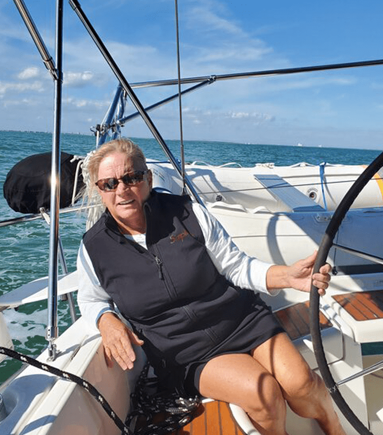 Boating and sailing graduate, Claudia, sailing off the shores of Key West in Florida. She enjoys the sunset in Florida from the best seat in the house, on her boat on the water.